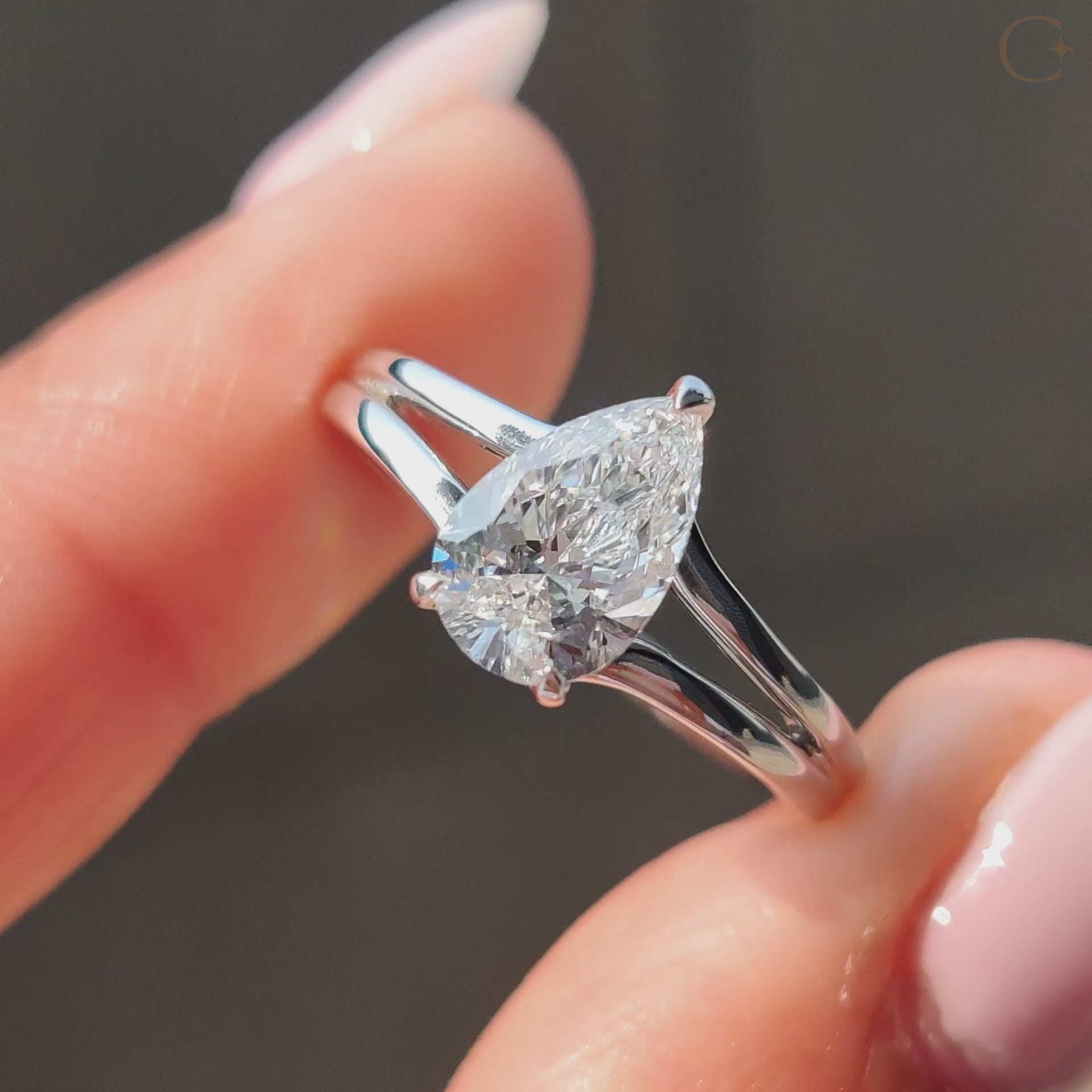 Hidden halo pear engagement ring with a stunning design that highlights the diamond's brilliance.
