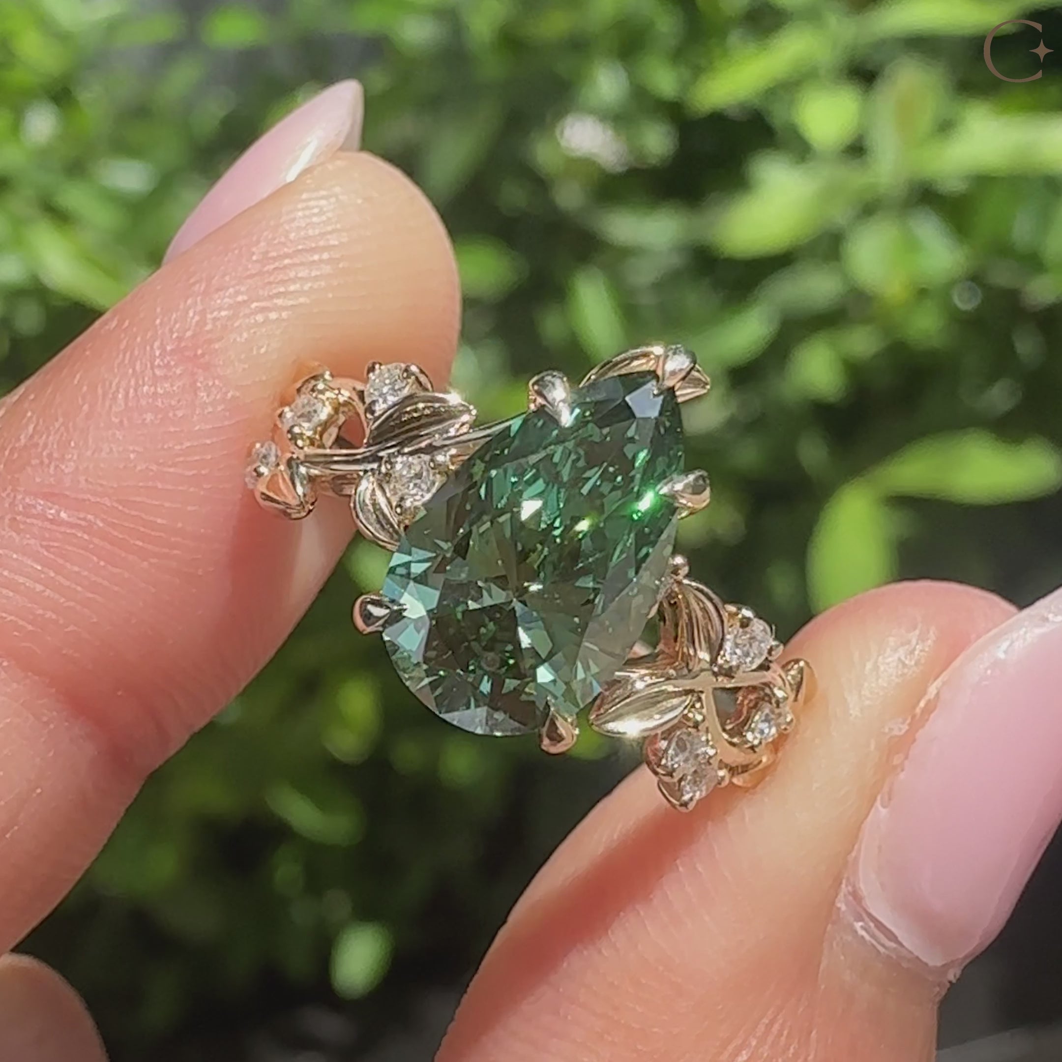 Nature inspired green pear shaped diamond ring.
