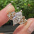 Dutch marquise center diamond with marquise and round side stones
