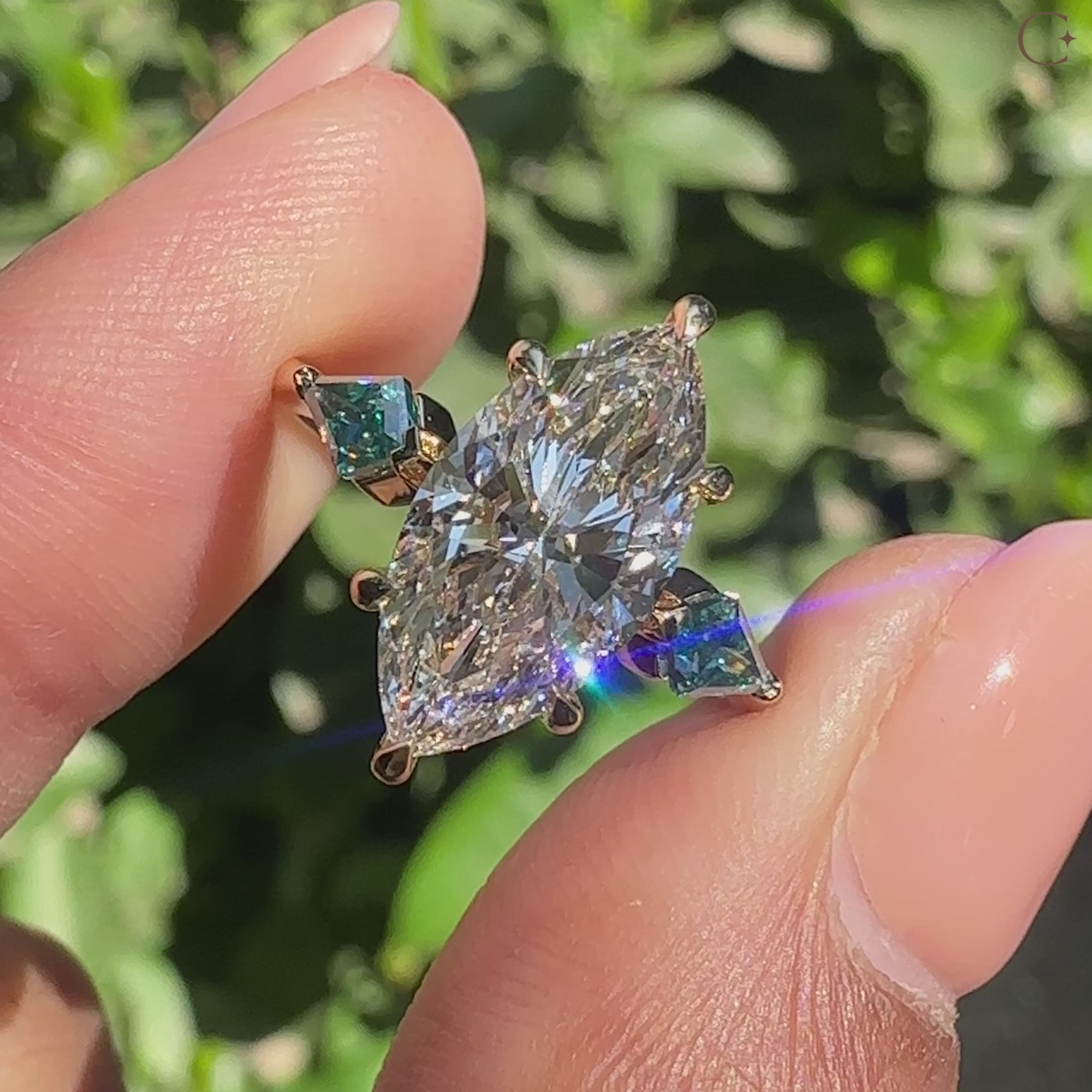 Marquise cut diamond ring with tapered shank band.