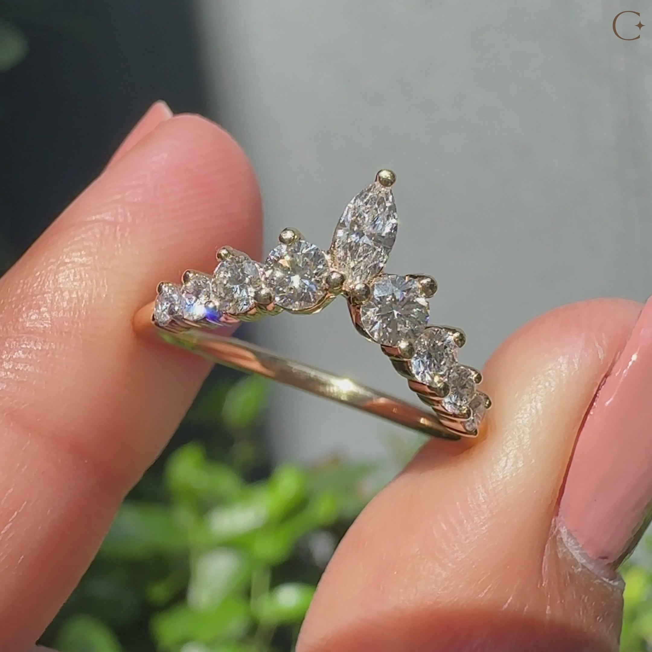 Wedding band featuring marquise and round diamond accents
