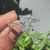 Four claw prong in cathedral setting engagement ring style.
