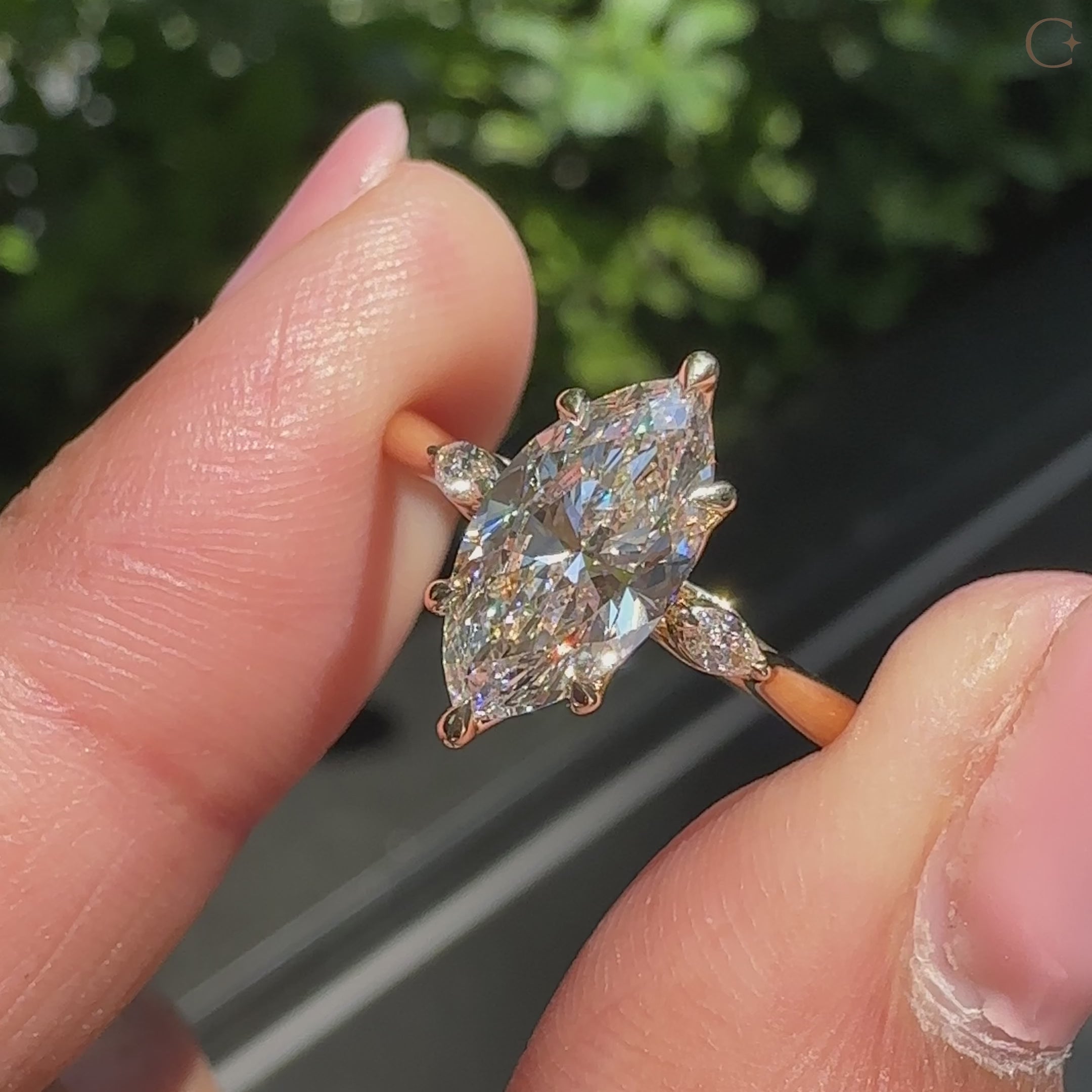 Lab grown marquise engagement ring with marquise side stones.
