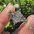 Marquise cut ring with leaf prong and side accents.
