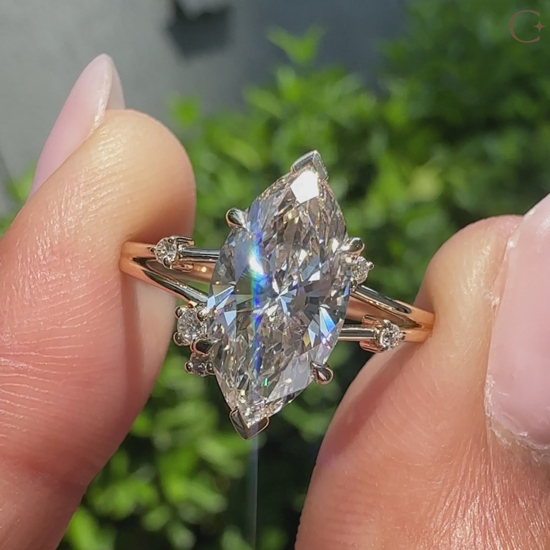 Marquise diamond engagement ring in yellow gold with split shank.
