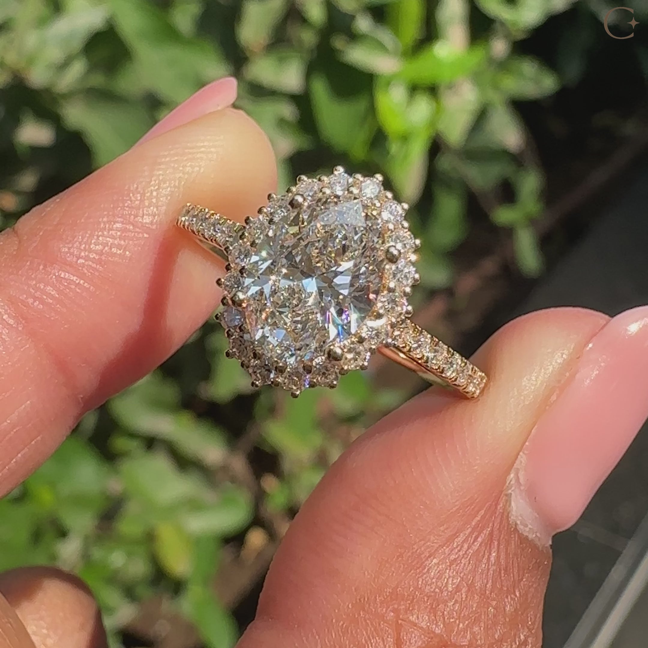 Halo setting ring with oval cut diamond center.
