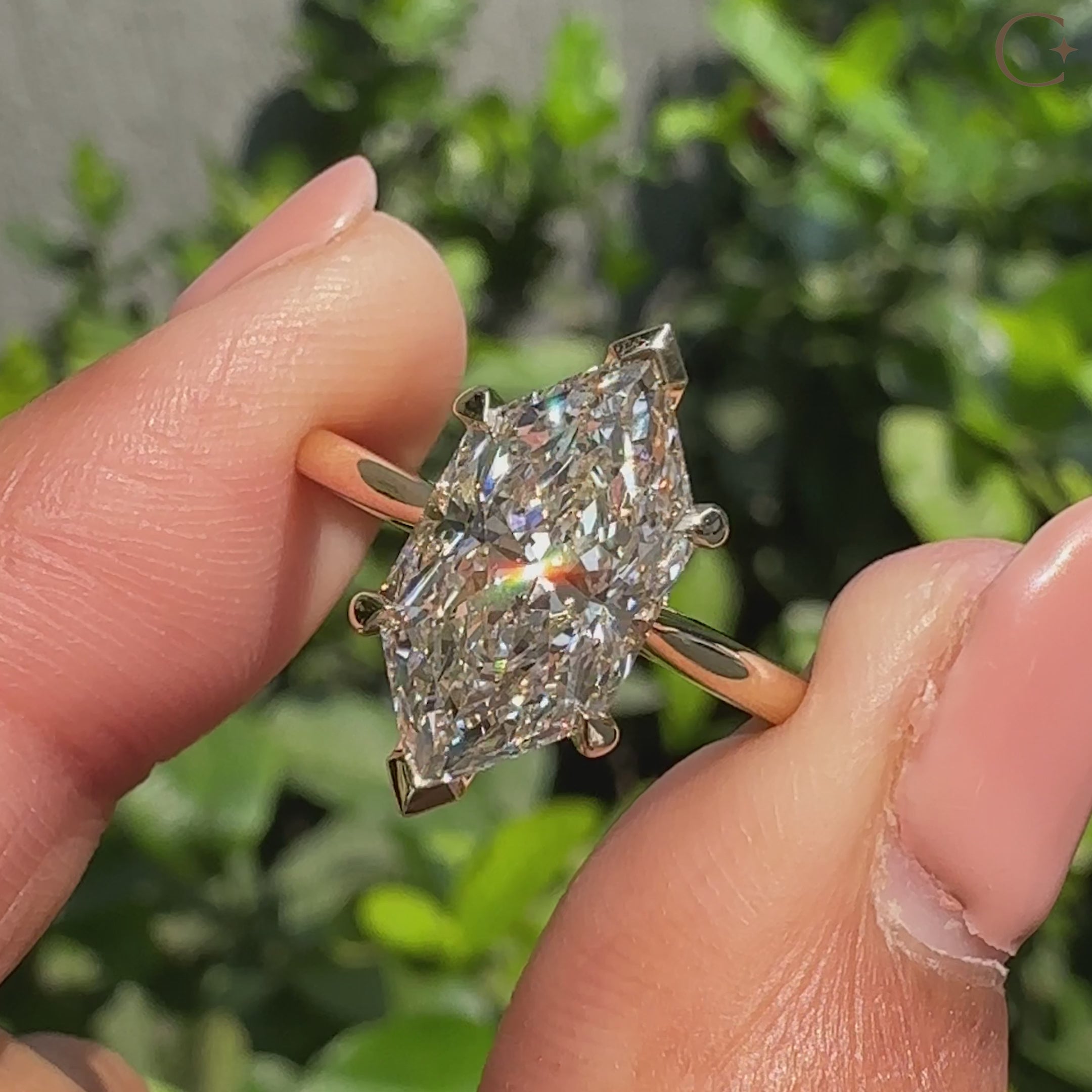 Dutch marquise engagement ring with cathedral setting and prongs.
