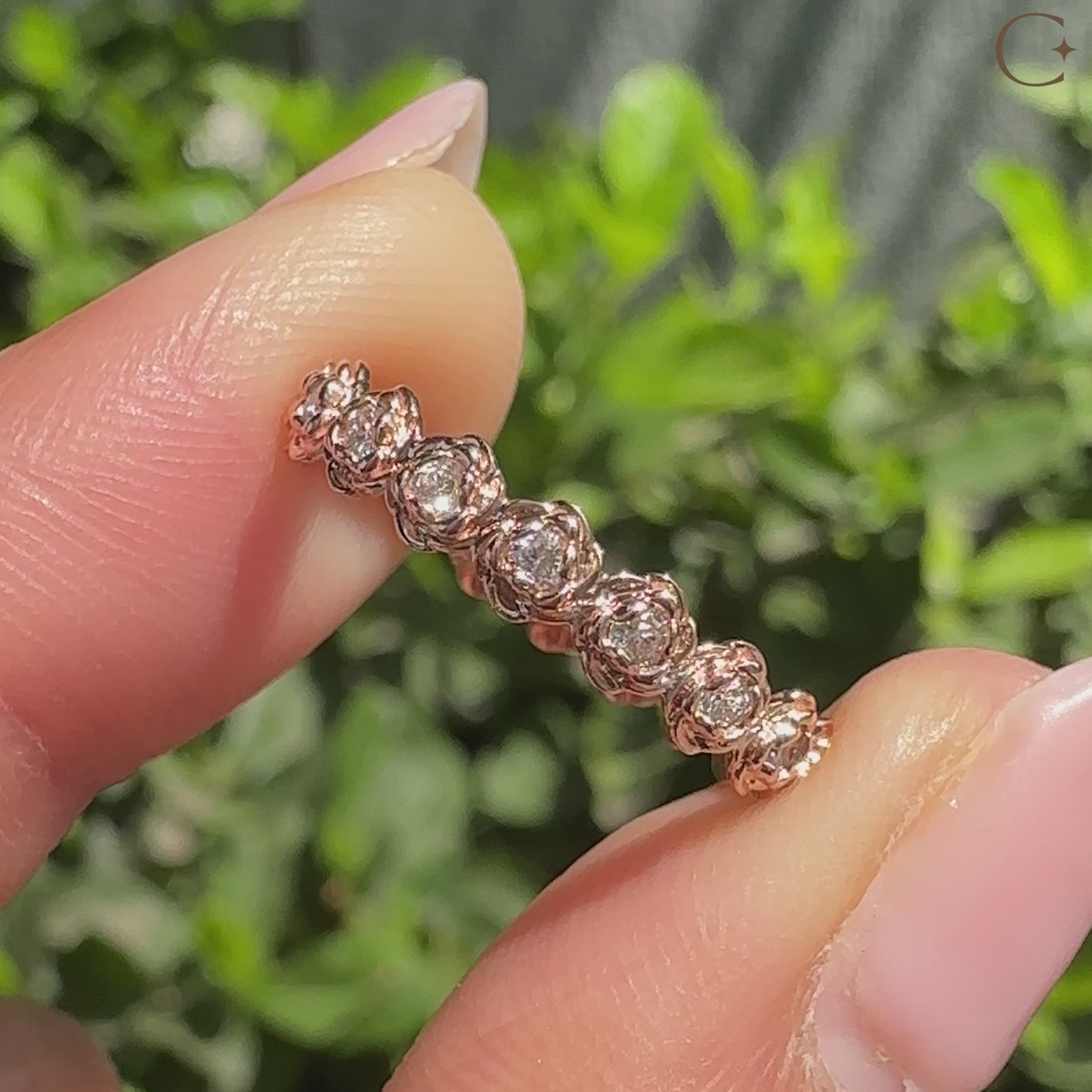 Round diamond eternity band with floral nature inspired design.
