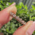 Round diamond eternity band with floral nature inspired design.
