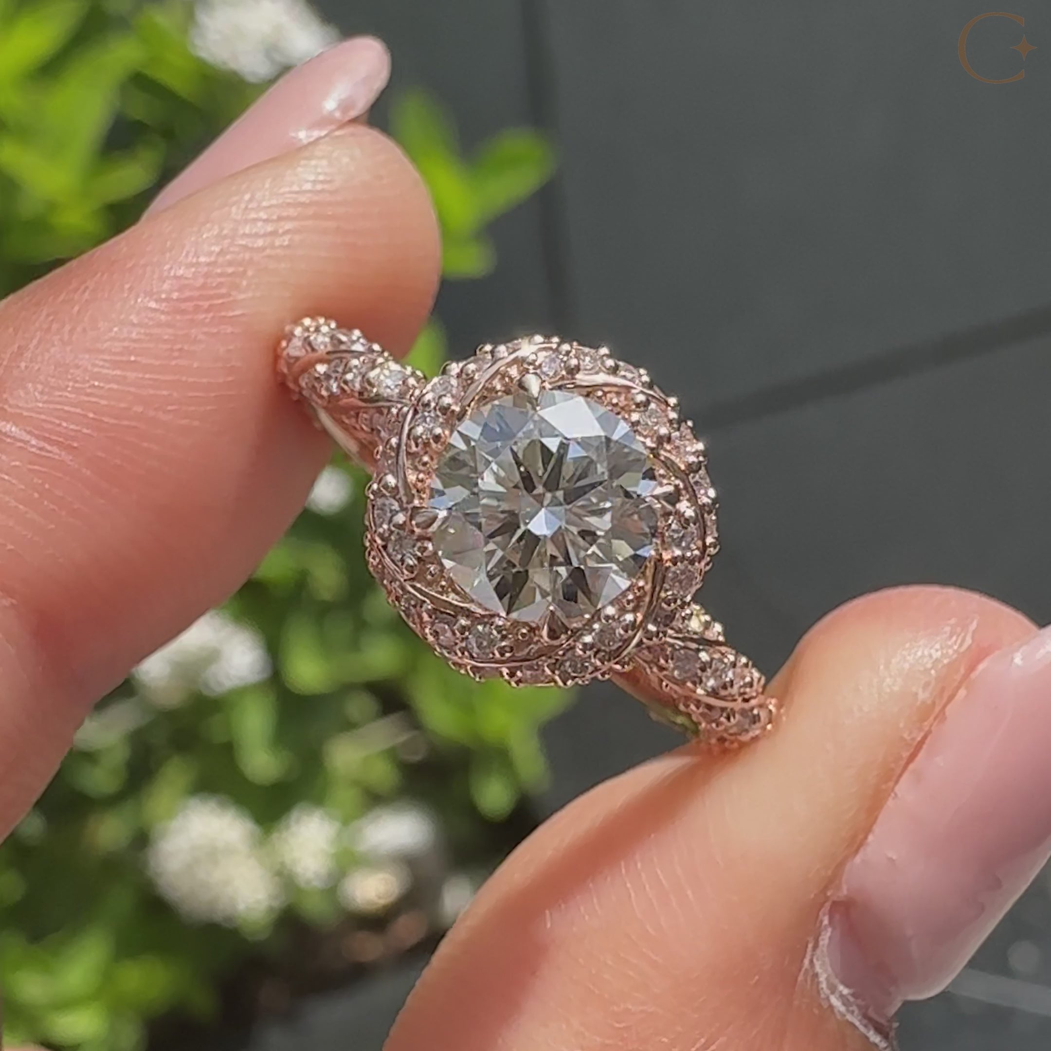 Round cut diamond ring with twisted halo style setting
