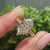 Dutch marquise center diamond with round diamond accents

