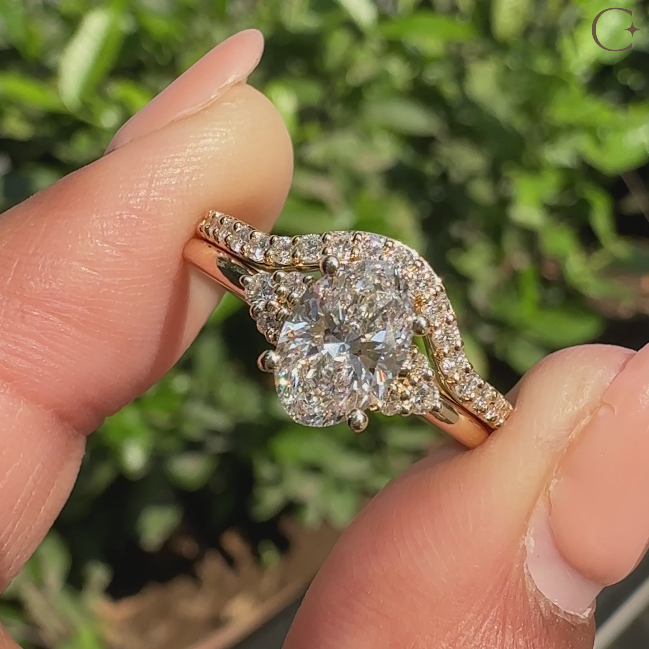 Handmade oval bridal ring set with round accent diamonds.
