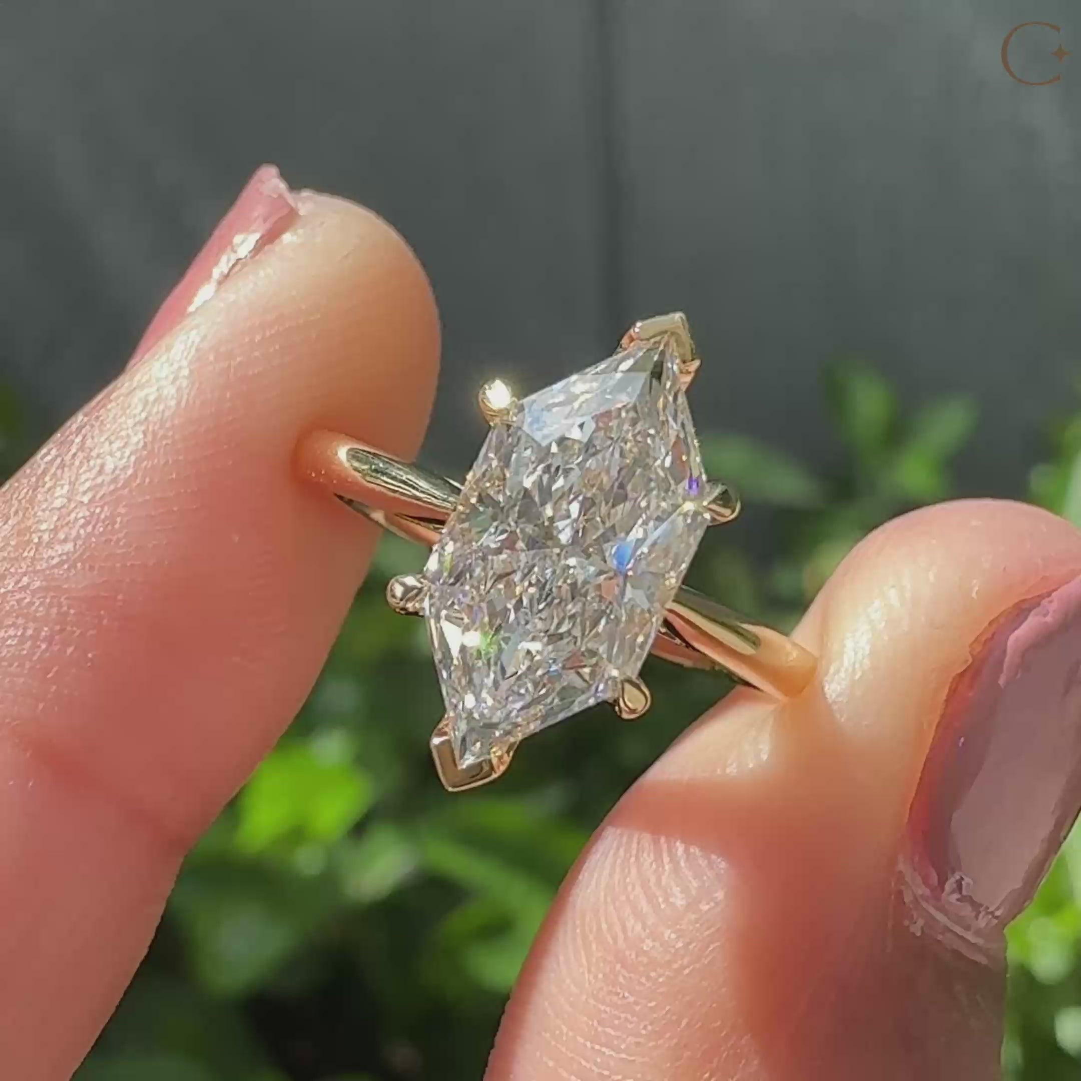 Tapered shank ring with v prong setting.