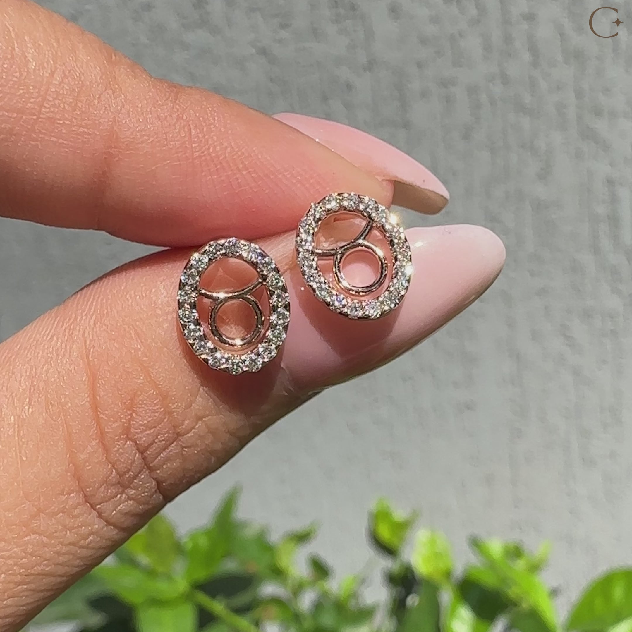 Handmade Taurus stud earrings featuring halo diamond design.
