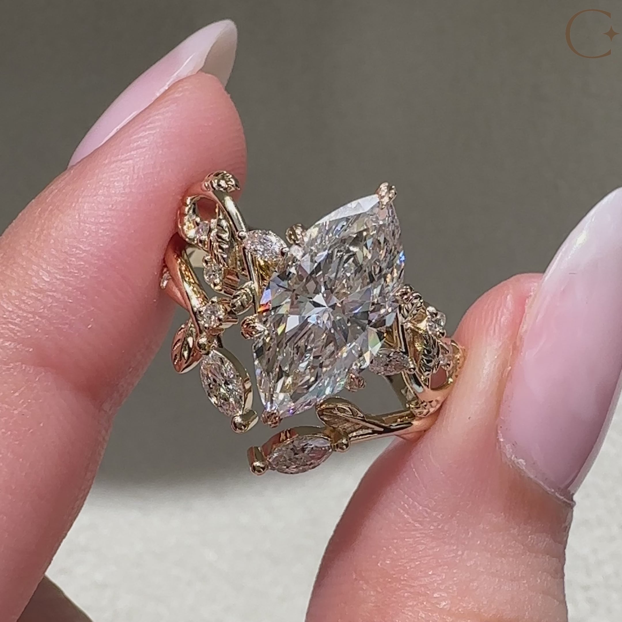 Leaf style bridal set with marquise center diamond and side stones