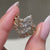 Leaf style bridal set with marquise center diamond and side stones