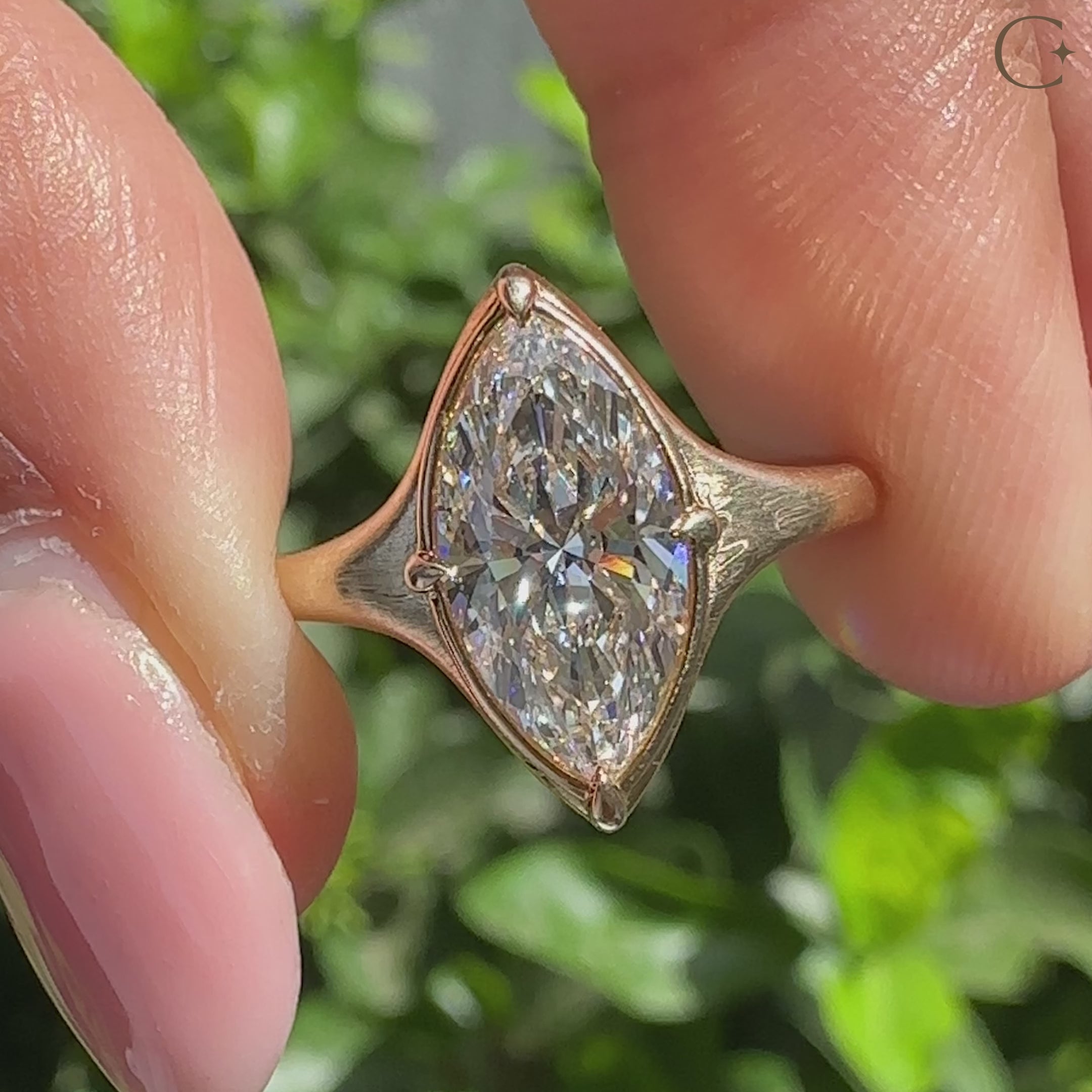 Handmade marquise diamond ring with four claw prong design.
