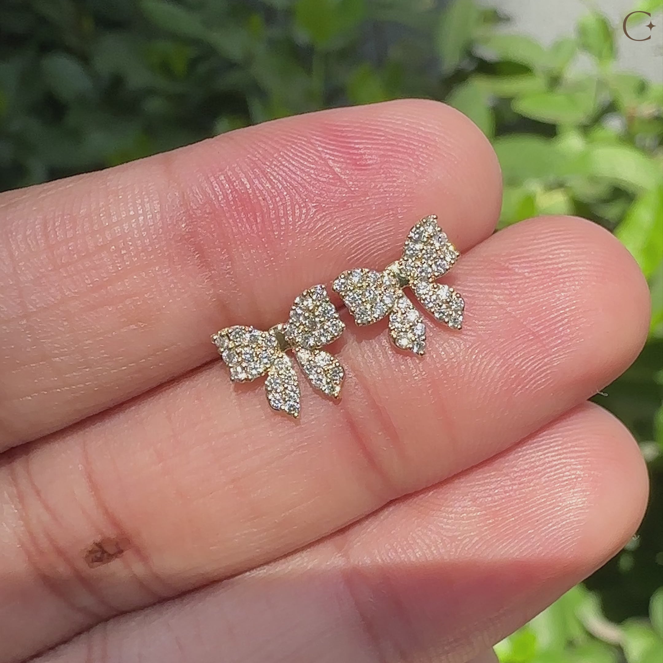 Yellow gold bow stud earrings handcrafted by Carat Diamonds