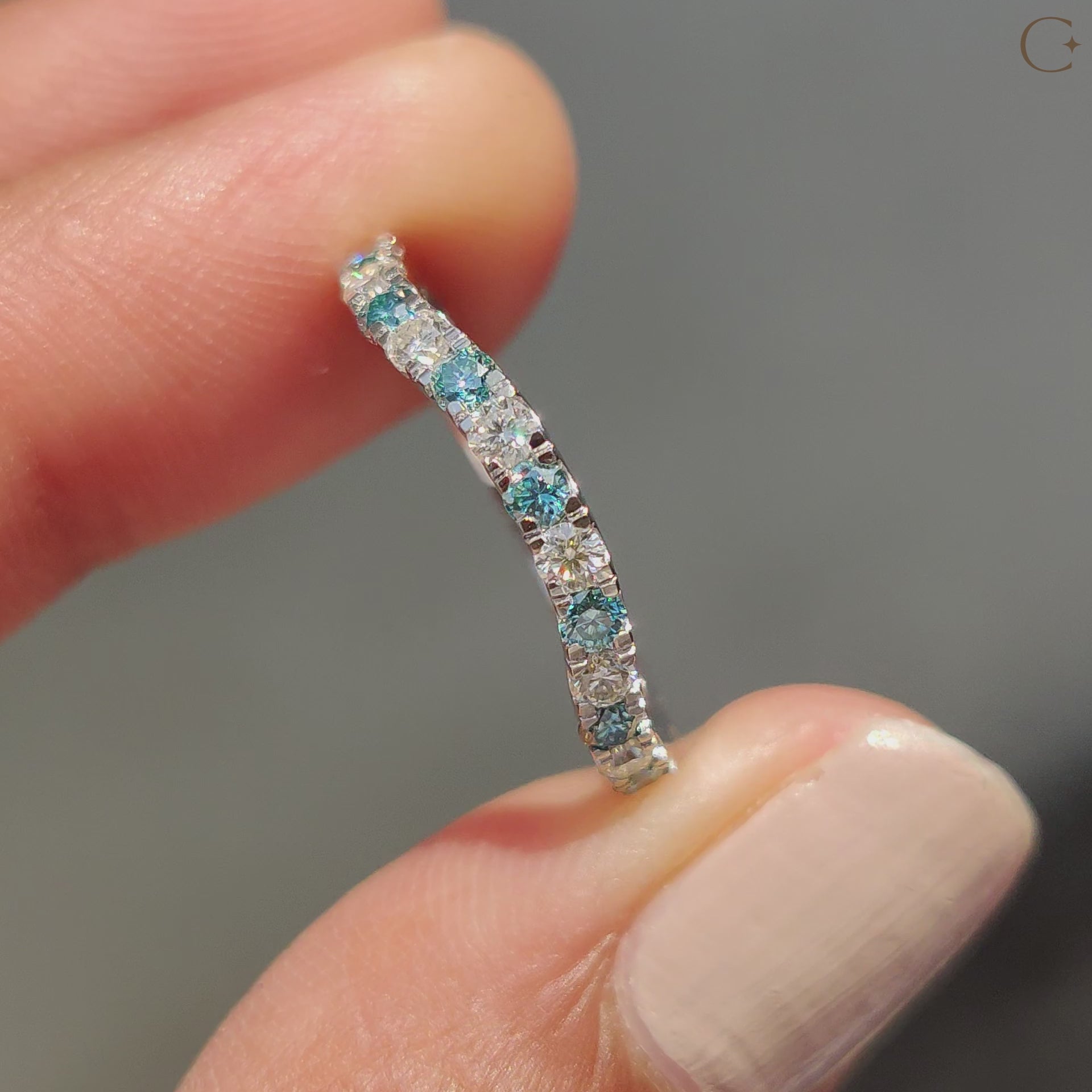 Moissanite wedding band with a round cut design and carat diamonds.