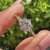 Five stone round diamond ring with tulip setting details
