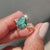 Oval and round cut ring paired with a milgrain setting in a handmade bridal set.

