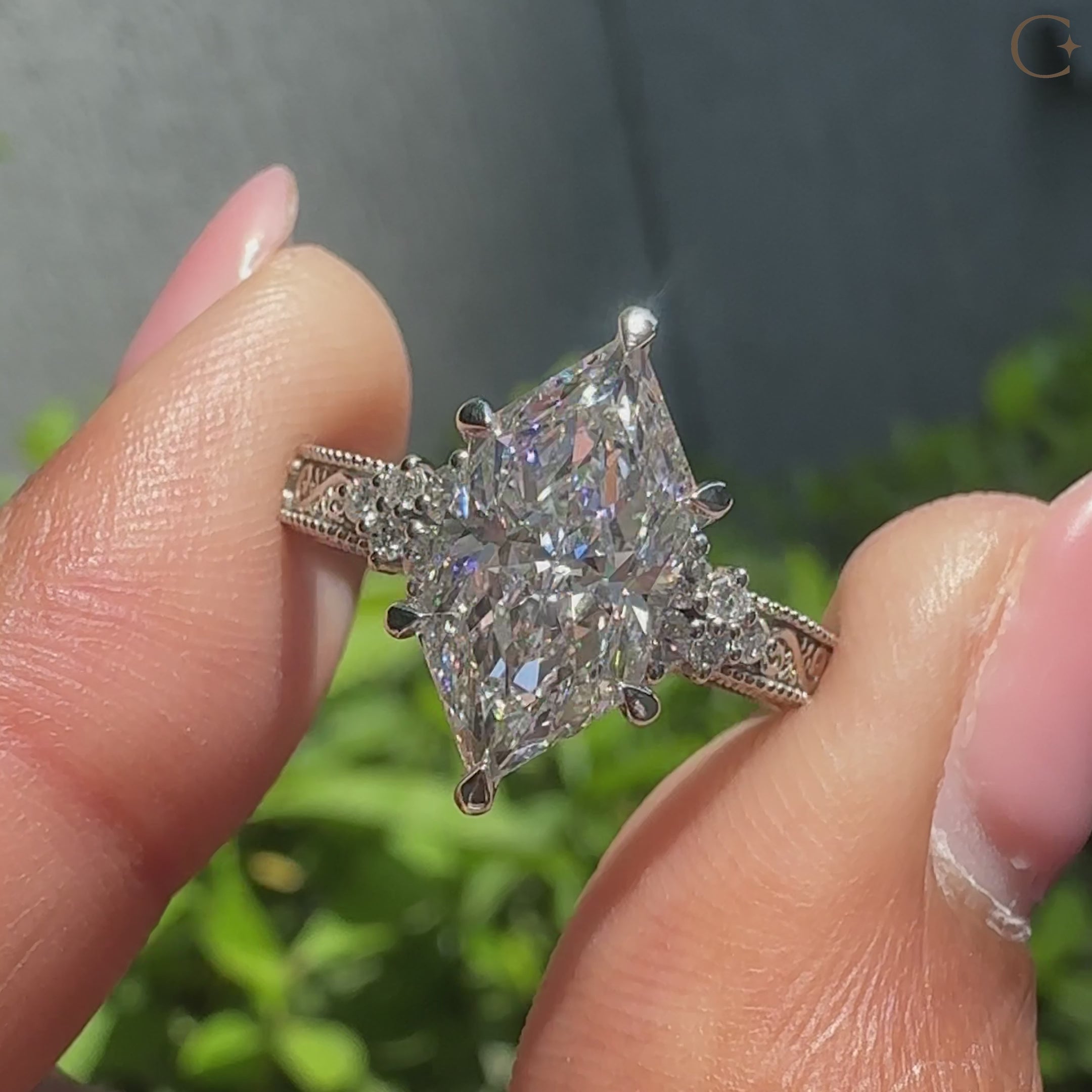 Dutch marquise center diamond with round aquamarine birthstone accents.
