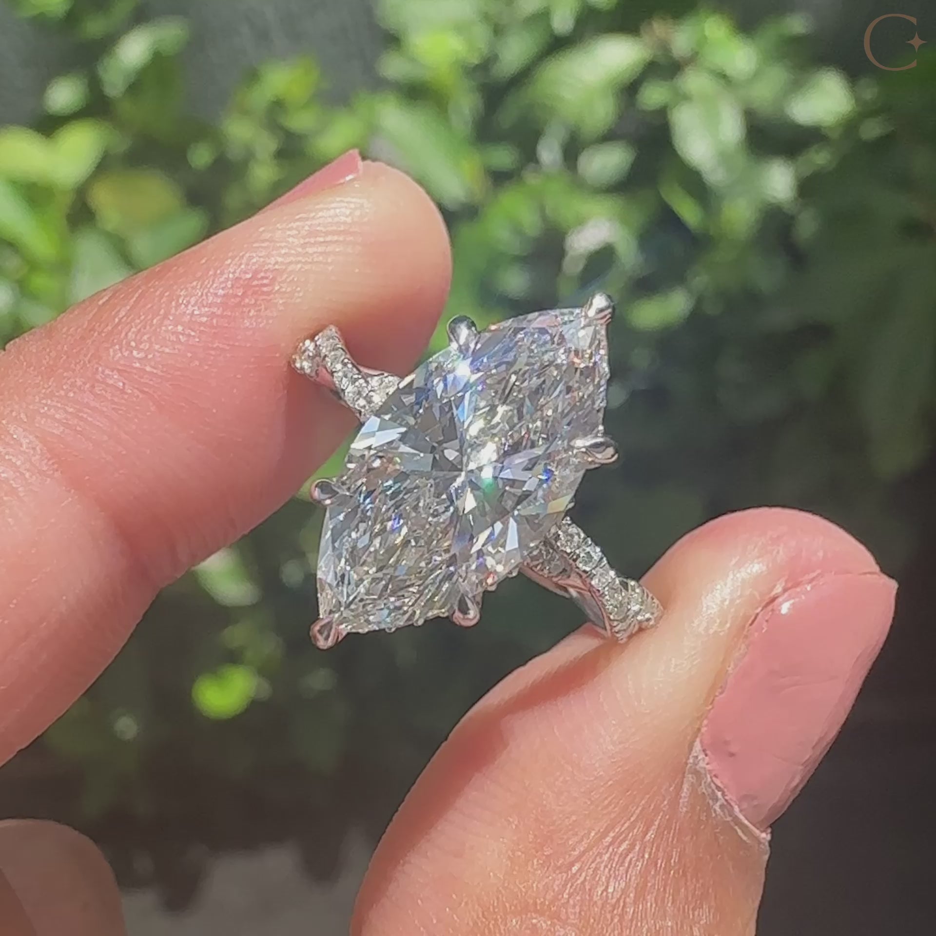 Hidden halo engagement ring with 6 claw prong setting.
