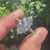 Hidden halo engagement ring with 6 claw prong setting.