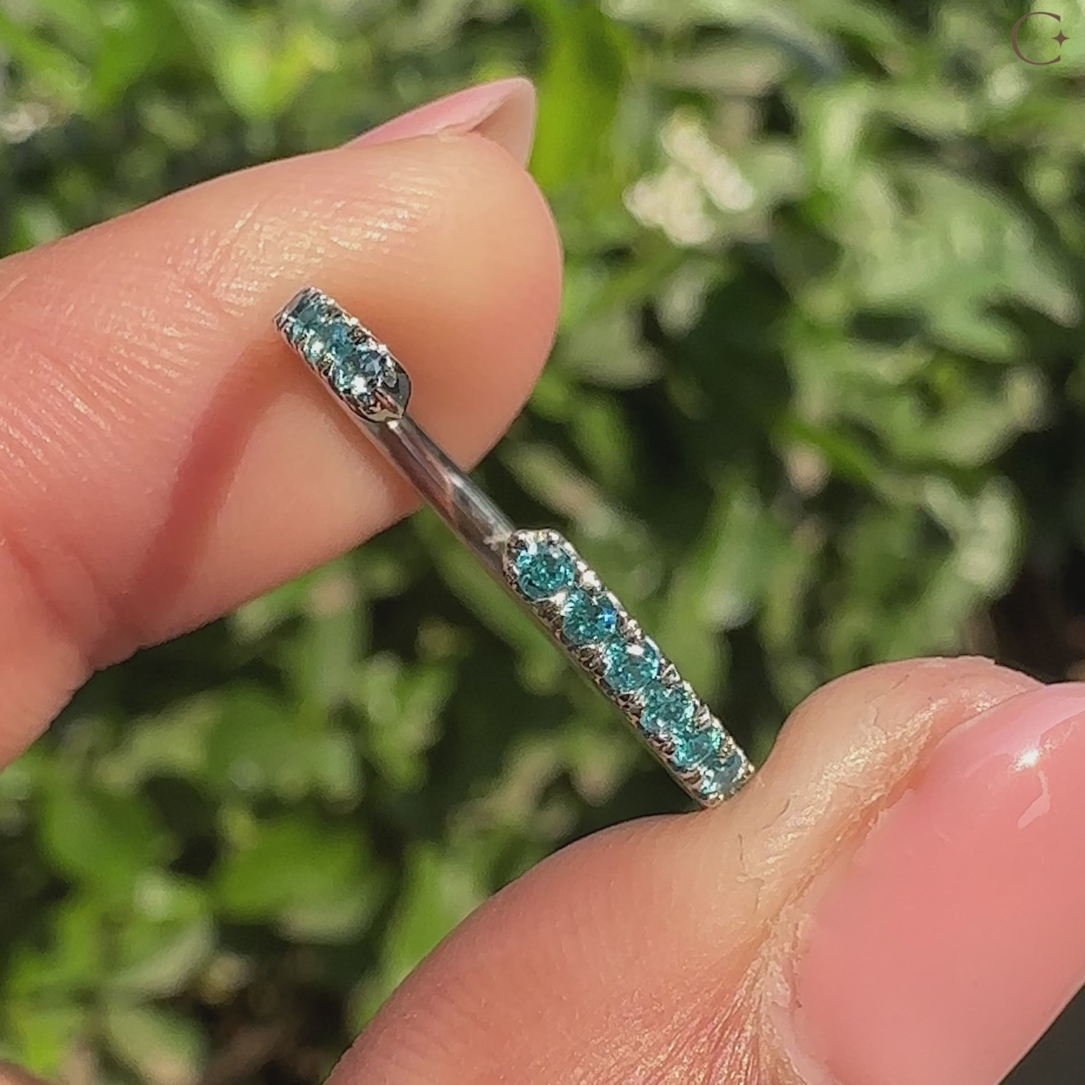 Handmade blue diamond band with round stones and stackable design.
