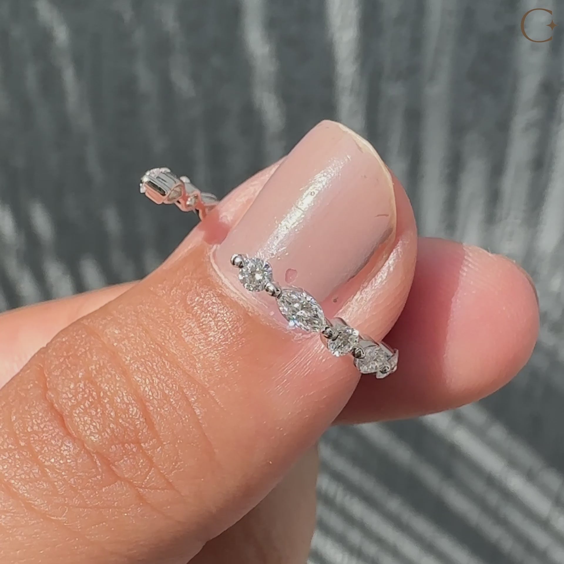 Marquise and round diamond band featuring a stunning arrangement of diamonds.
