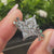 Nature style diamond ring with green gemstones and prongs
