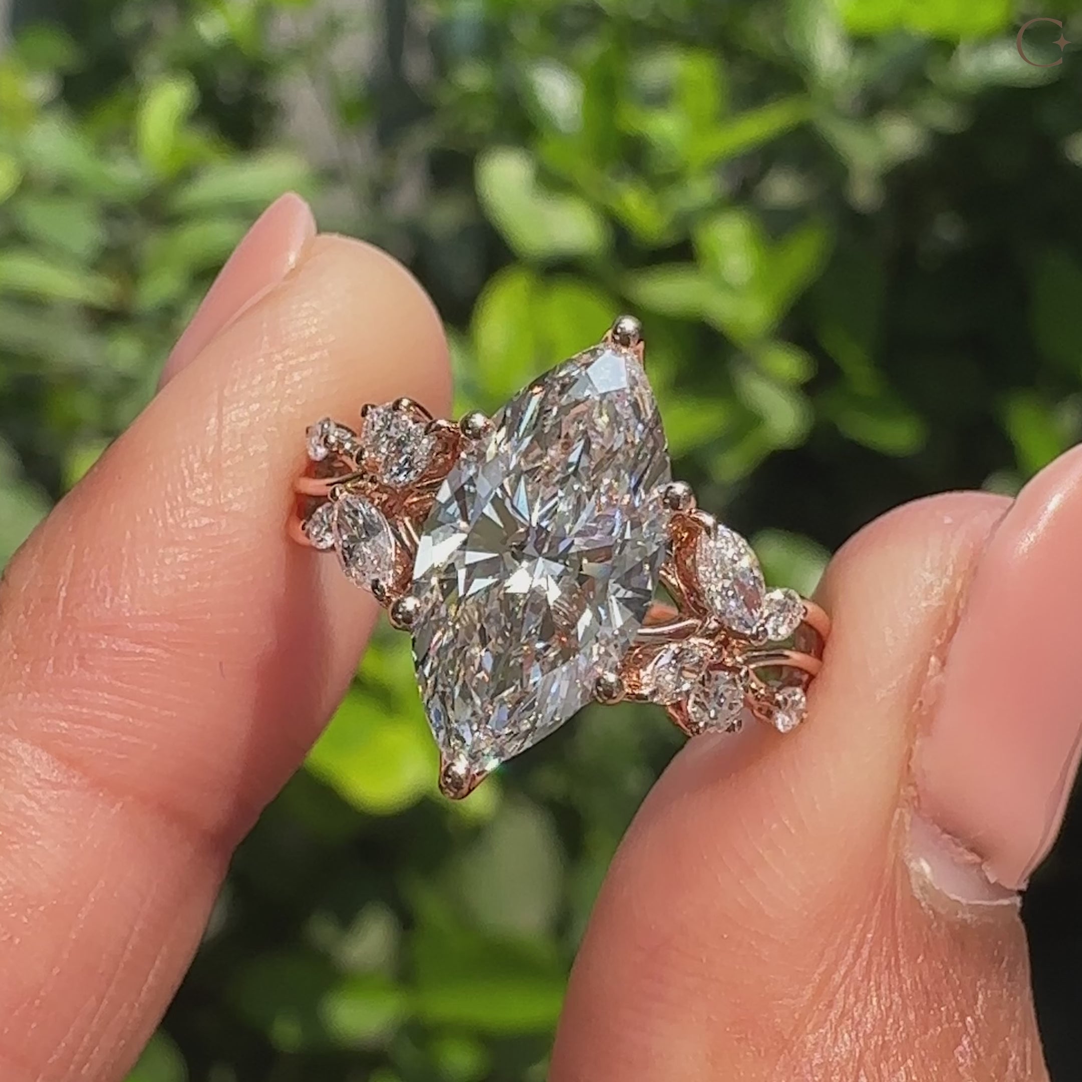 Handmade marquise diamond ring with round side stones
