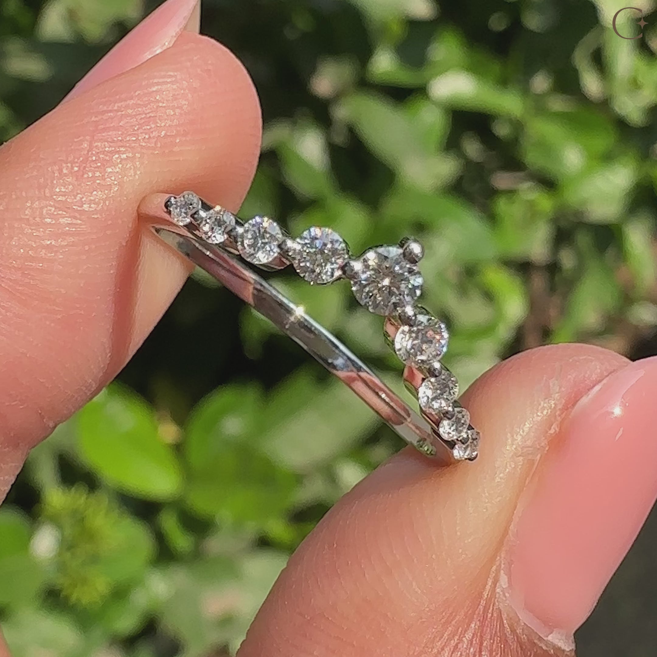 U shaped diamond wedding band with shared prongs.
