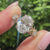 Thorns style three stone ring with oval diamond
