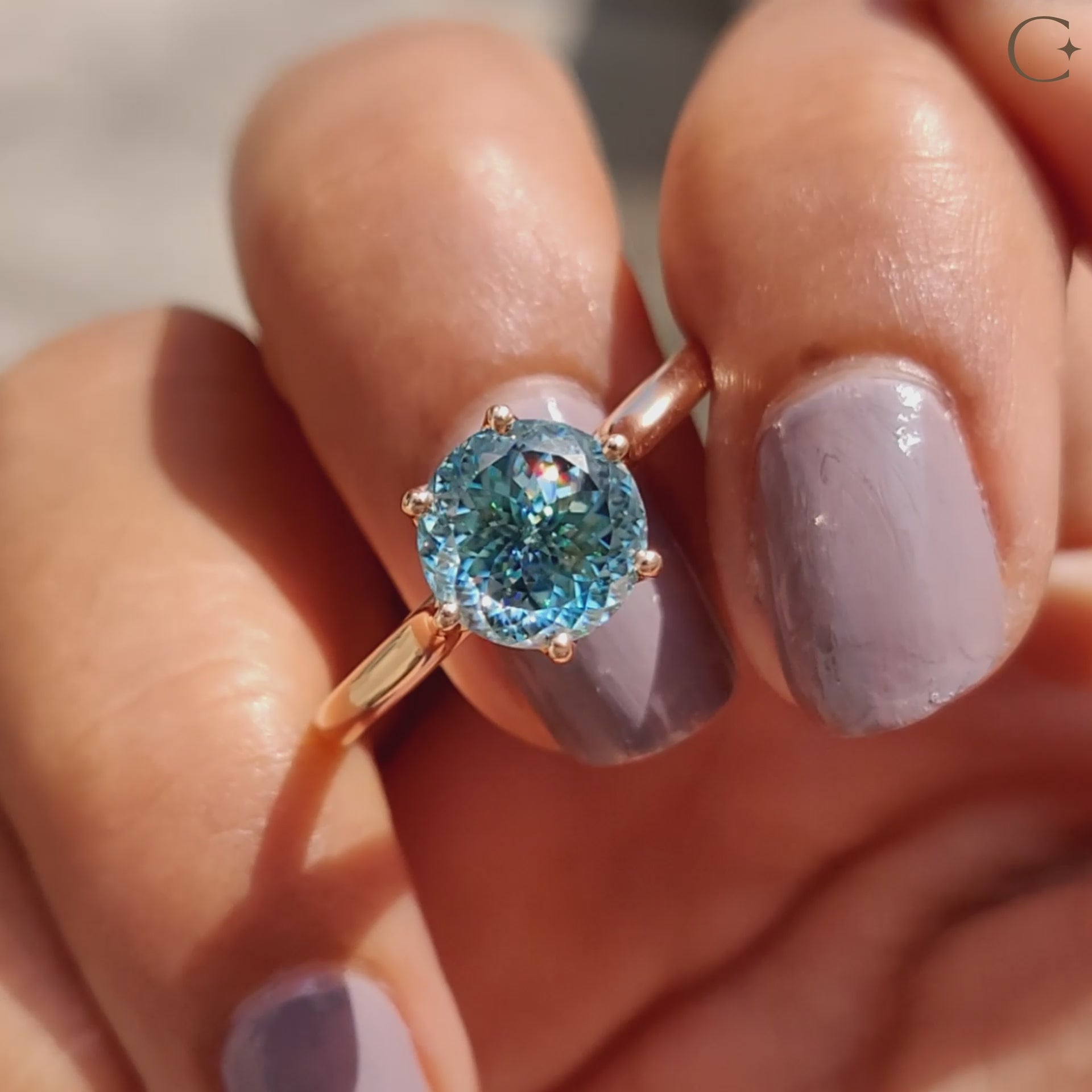 A cyan blue moissanite ring shines with brilliant sparkle and eco-friendly sourcing.