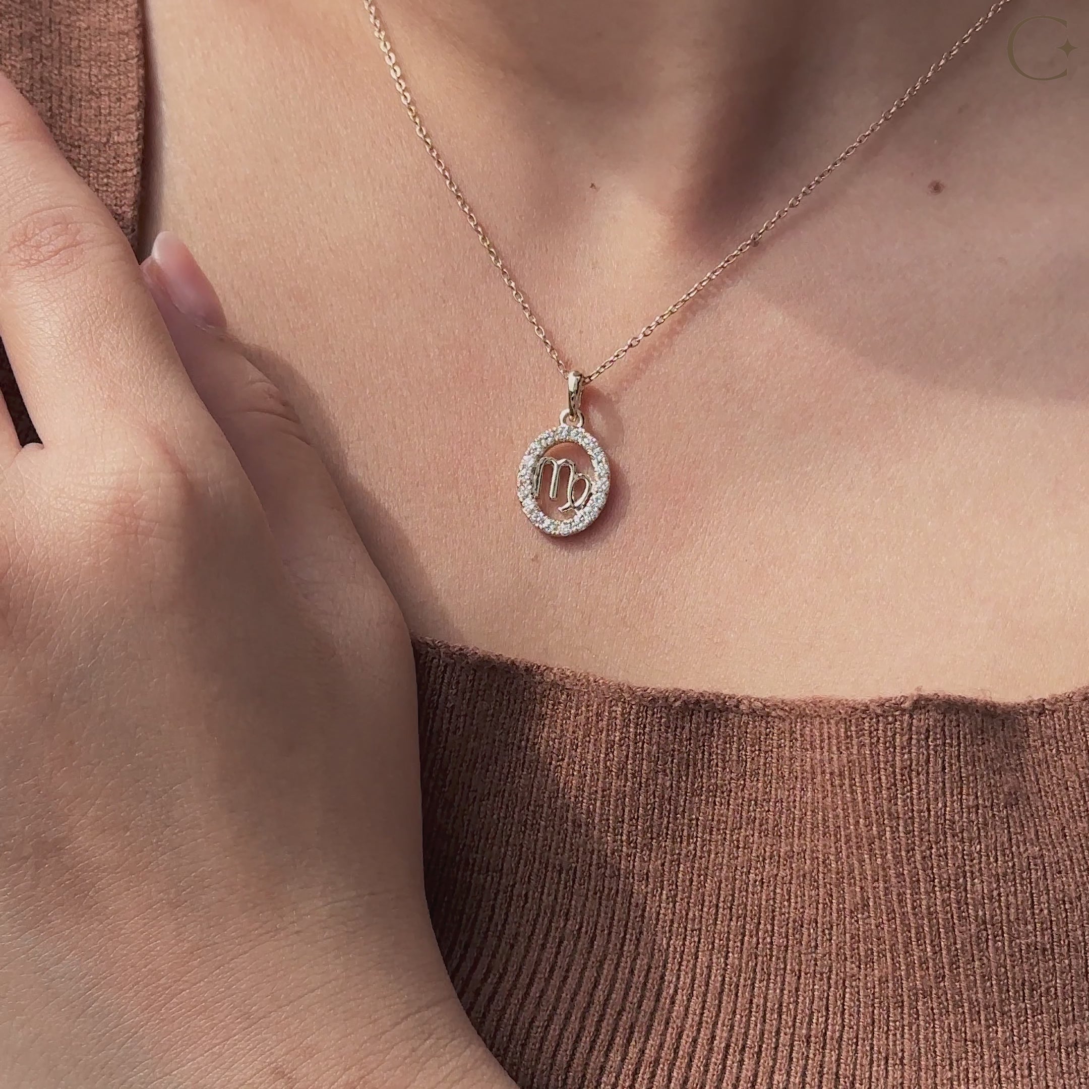 Handmade Virgo pendant in yellow gold with halo diamond design.