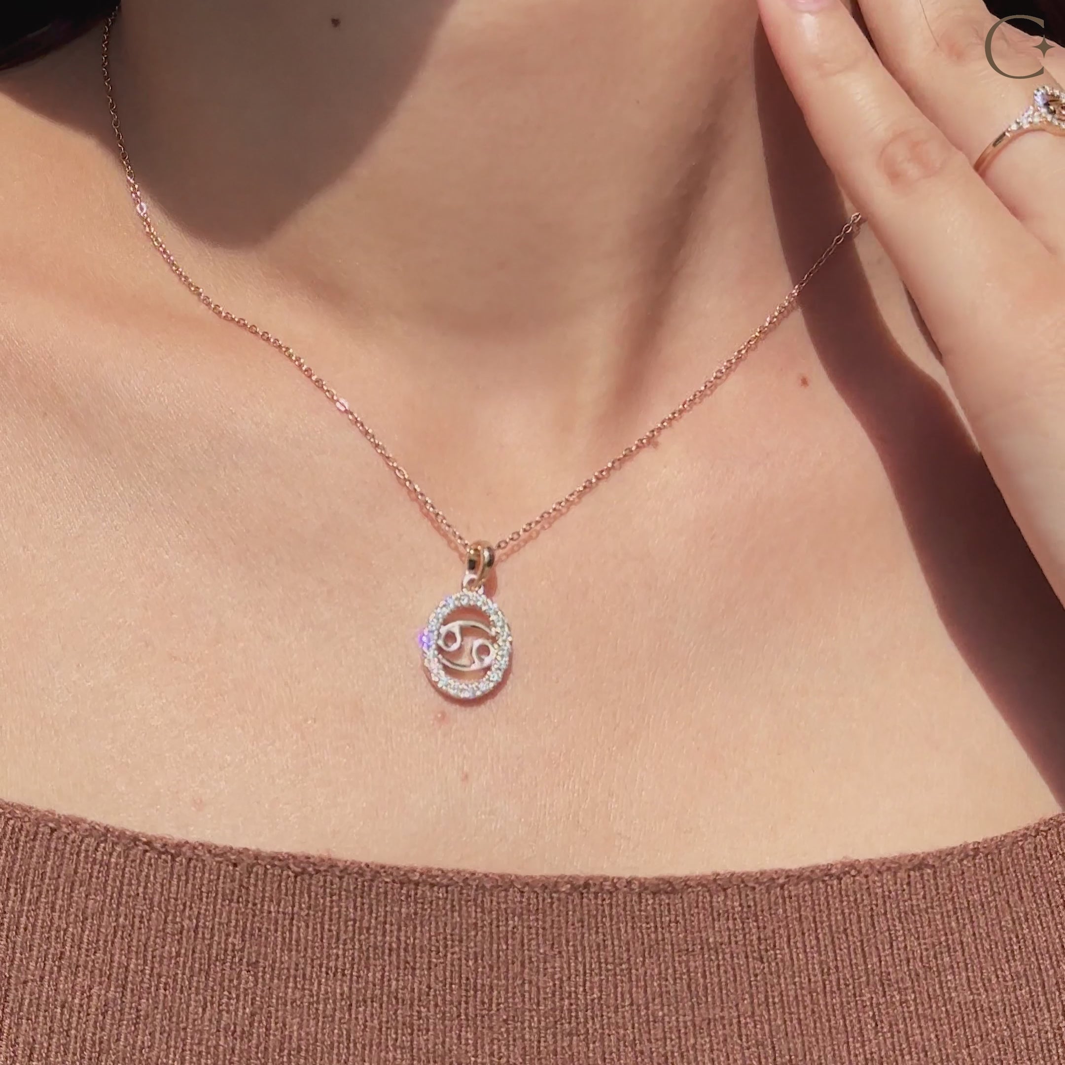 Handmade Cancer pendant in yellow gold with halo diamond design.