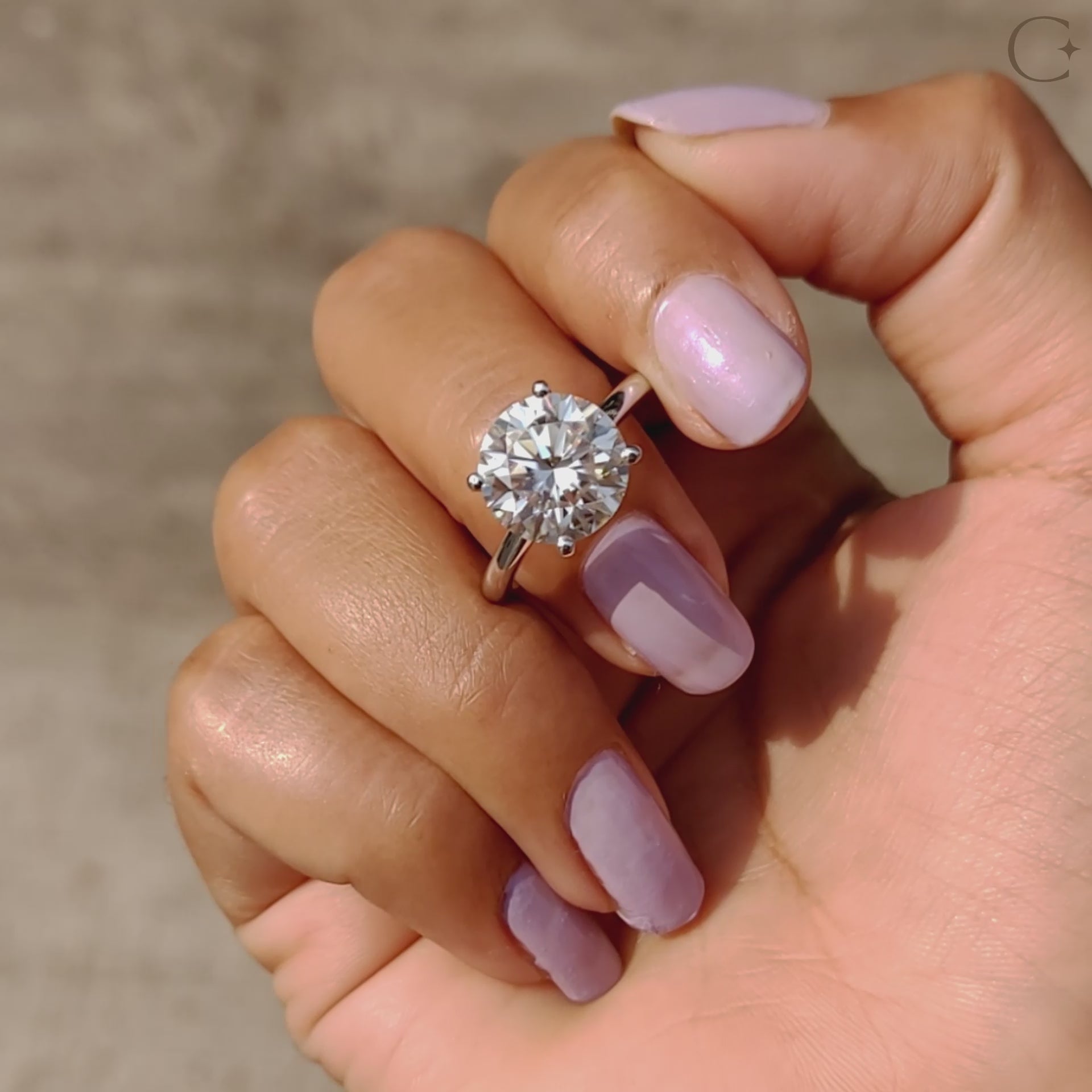 Round engagement ring with moissanite center.