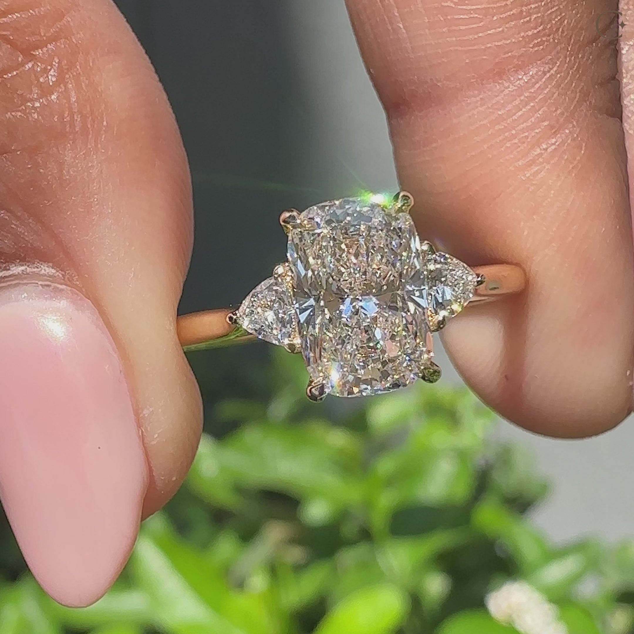 Three stone engagement ring with tapered shank and 4 claw prong setting.
