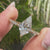 Kite shaped center diamond set in yellow gold.
