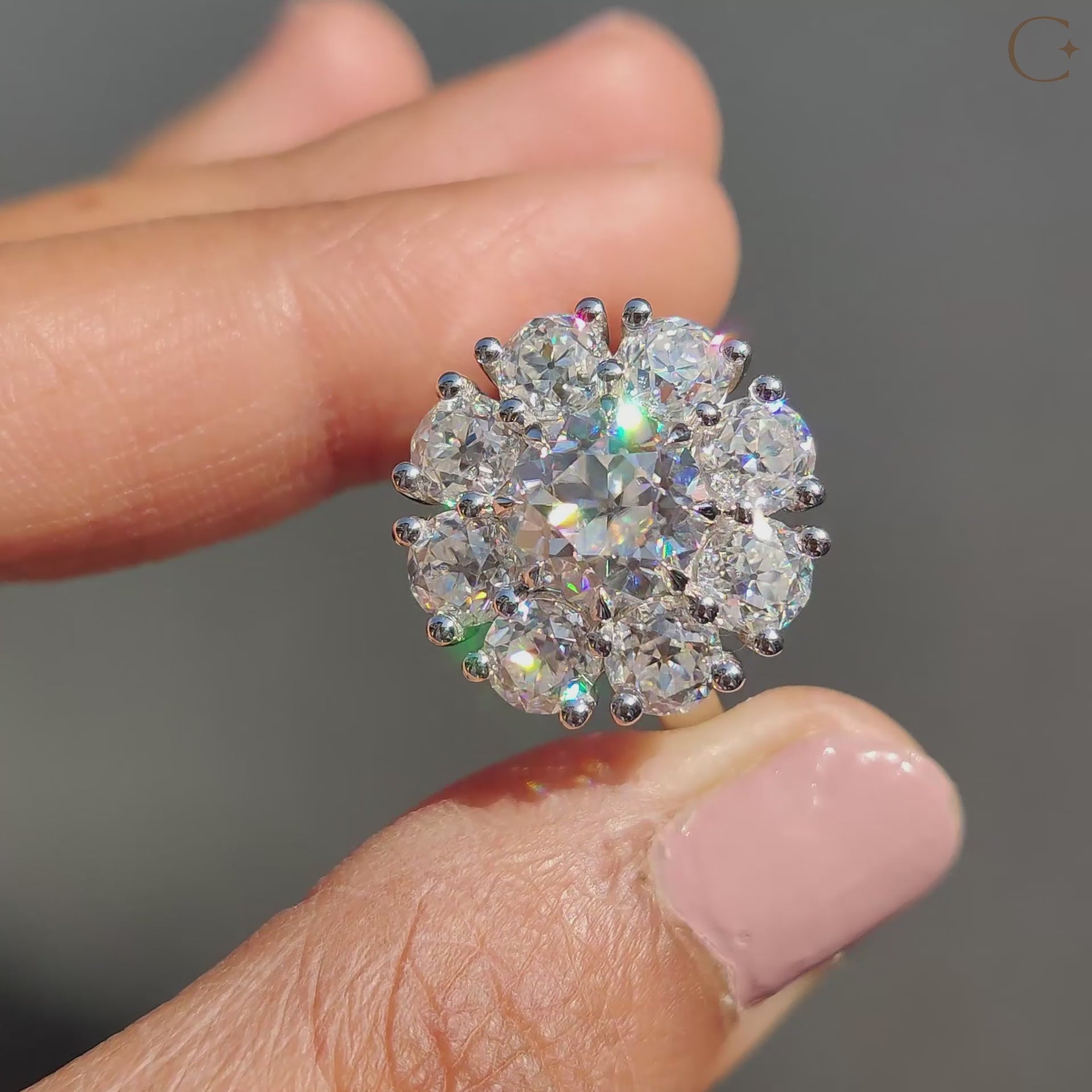 White gold engagement ring with halo and cathedral setting