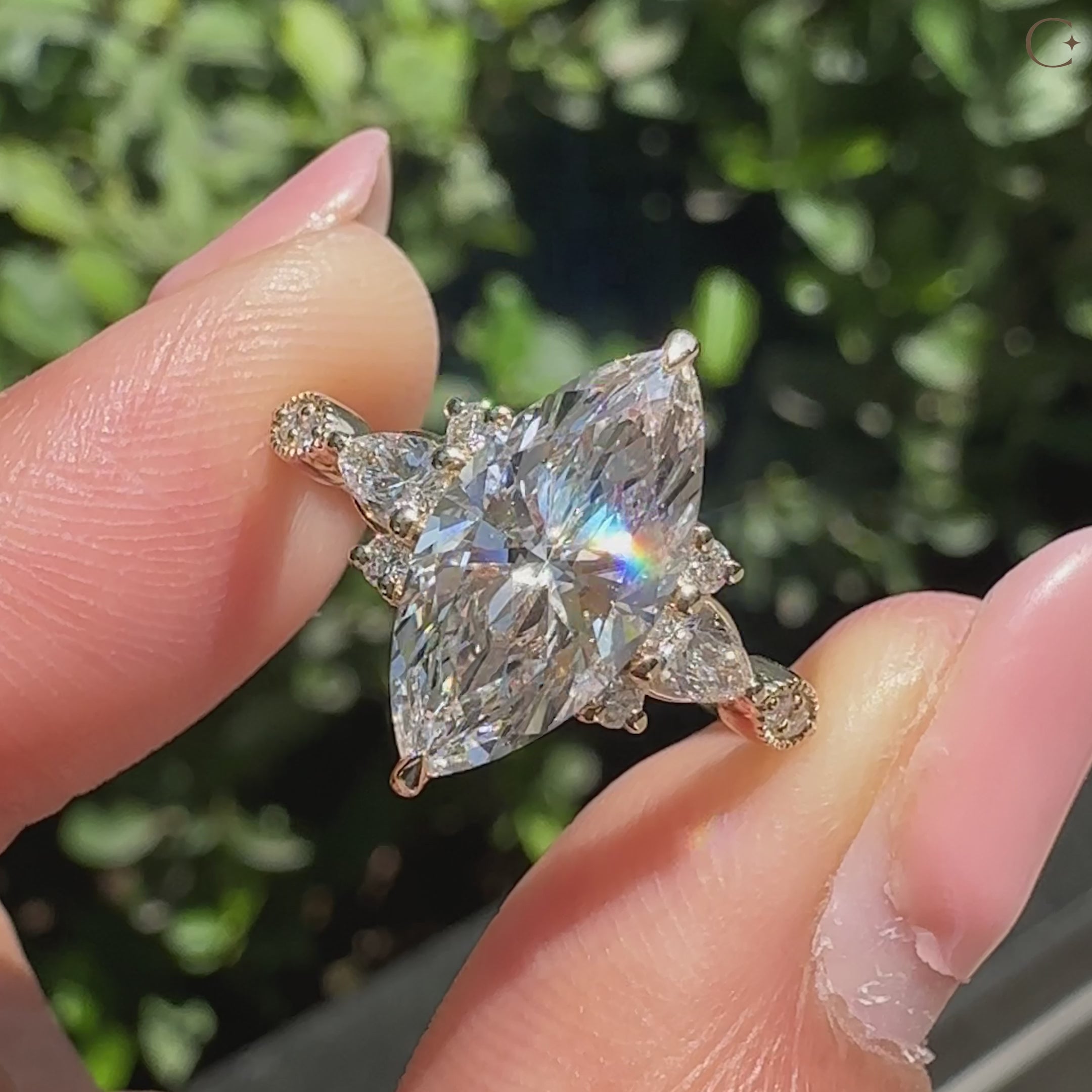 Handmade marquise ring with pear and round side diamonds.
