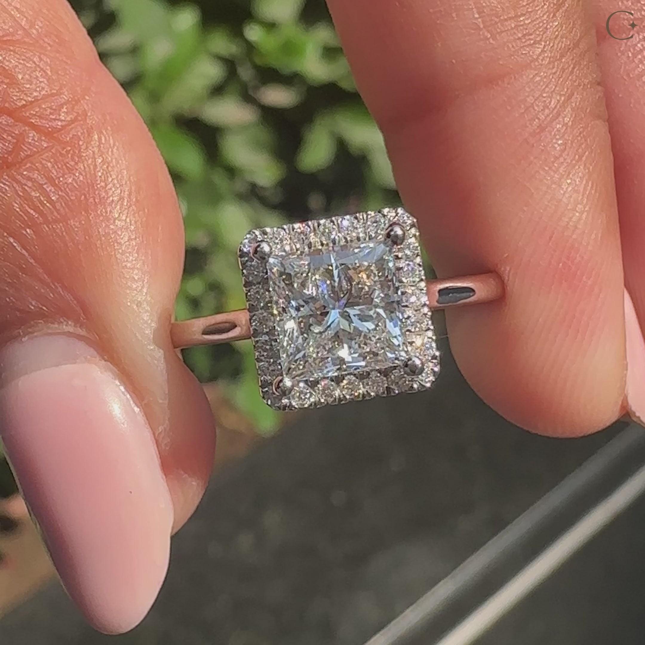 Princess cut diamond ring with round halo
