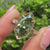 Round diamond hidden halo flower crown ring.
