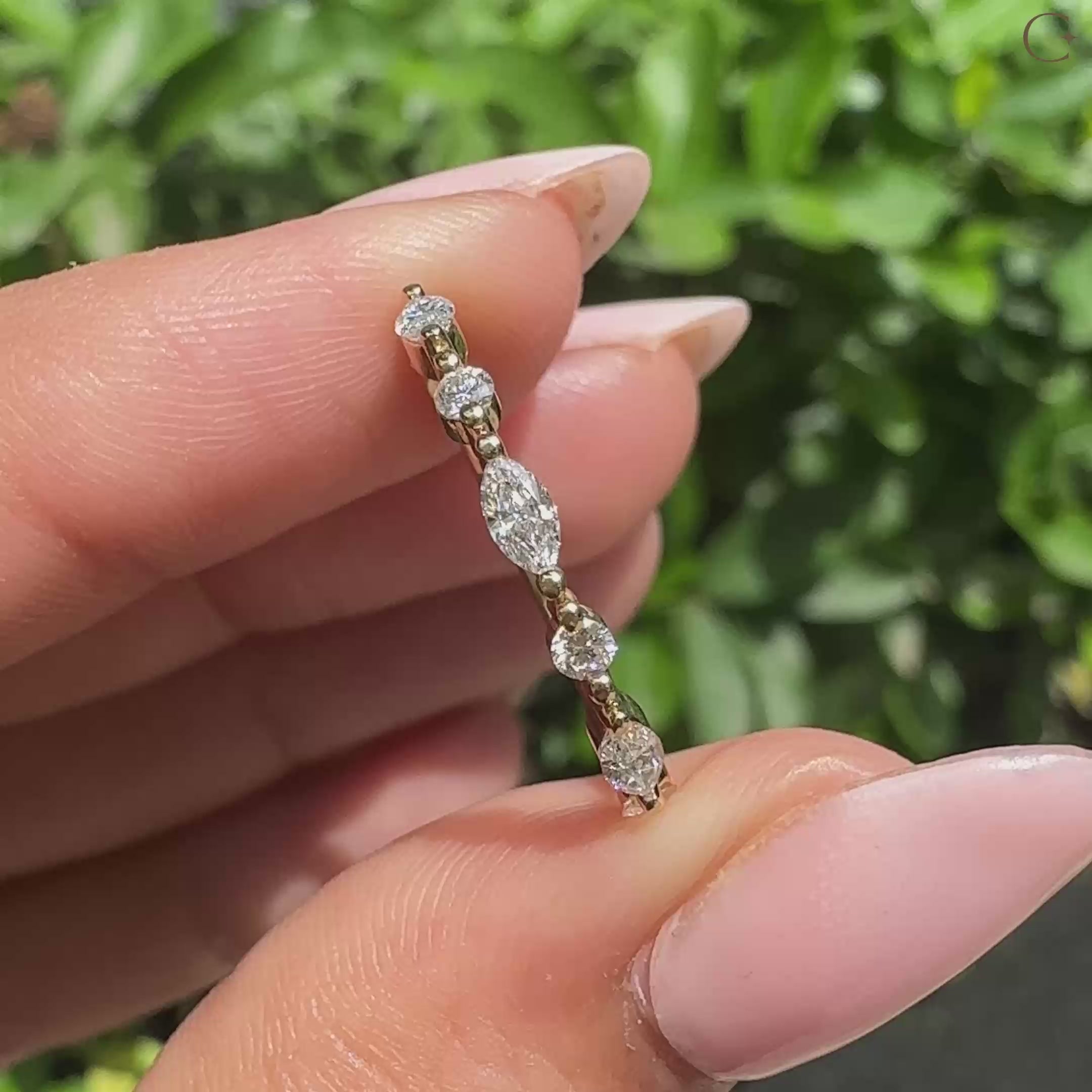 Marquise and round wedding band in 3/4 eternity band.