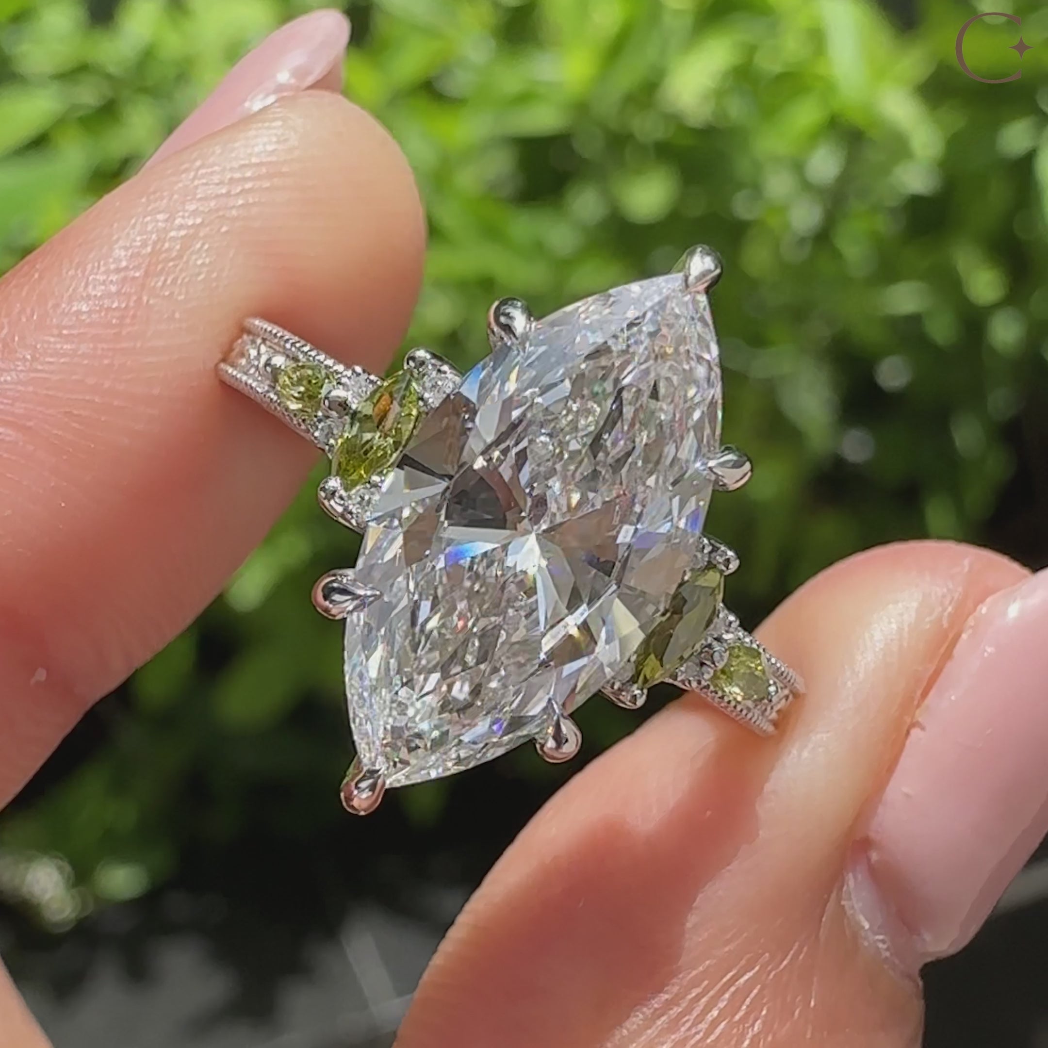 Vintage marquise diamond ring with round accent side stones
