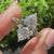 Vintage marquise diamond ring with round accent side stones
