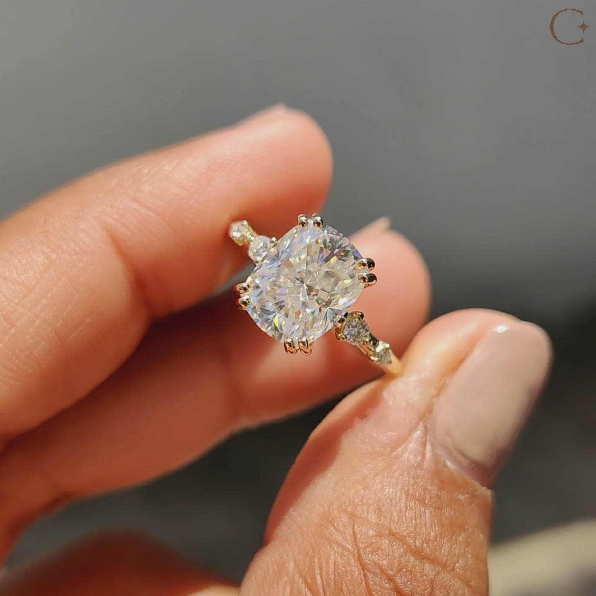 4 round cut moissanite stones in a custom engagement ring.
