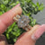Lab grown oval diamond bridal set with engraved filigree shank details.
