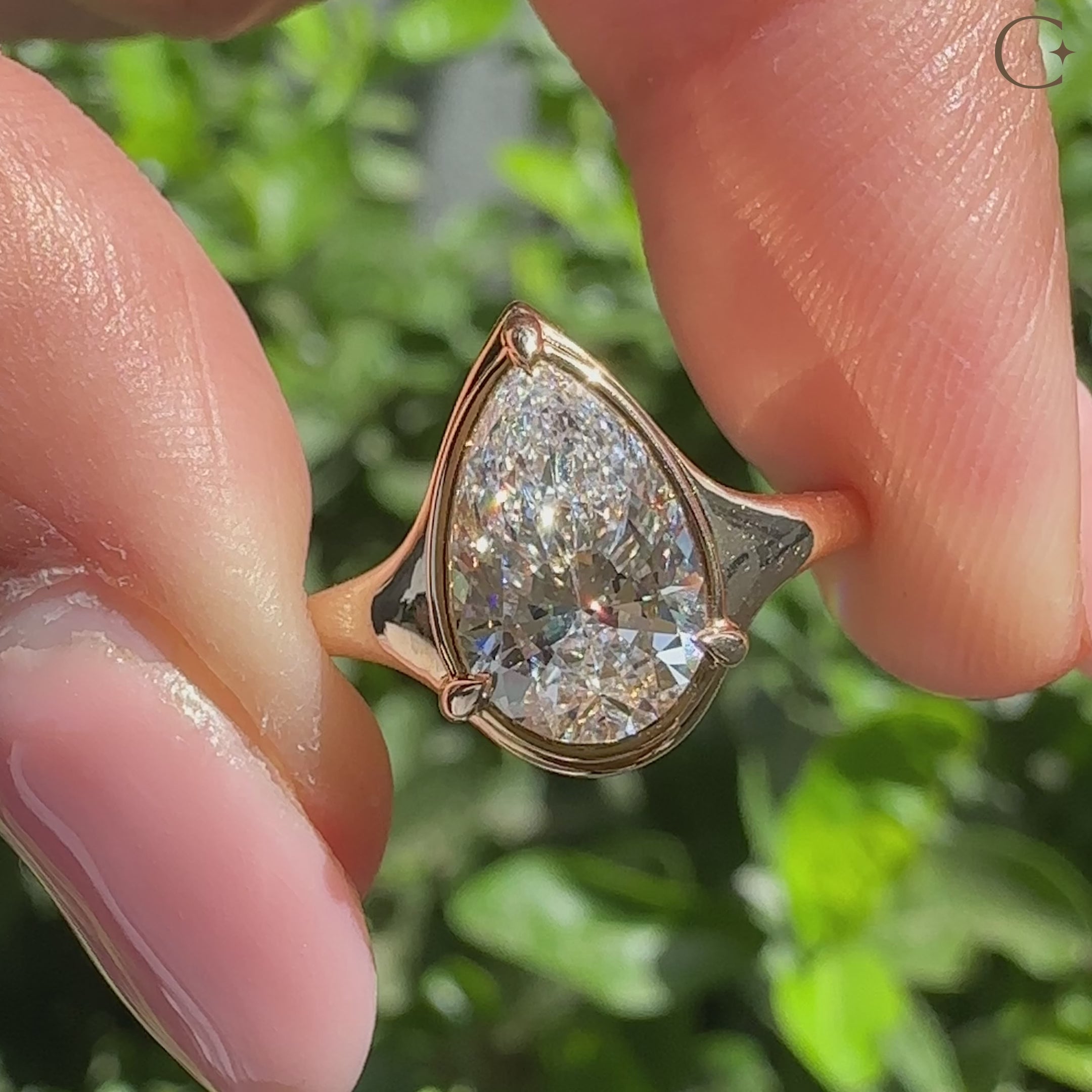 Handmade pear cut diamond ring with three claw prong.
